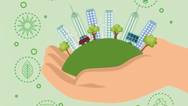 Imagen digital de una mano con una ciudad ecológica
